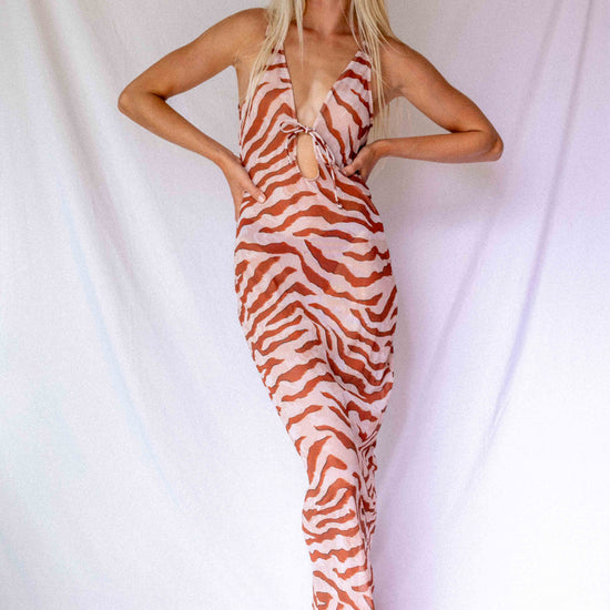 Maxi Dress in Dune animal print, full-length front view showing deep V-neckline, front tie detail, and flowing silhouette by Antidote The Label