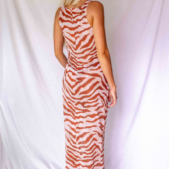 Maxi Dress in Dune animal print, back three-quarter view showing racerback and floor-length flowing silhouette