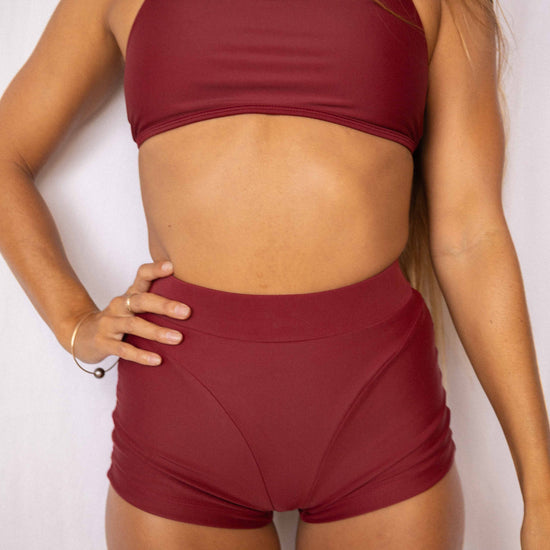 Niki Surf Top and Shorts set in Deep Merlot, front torso view showing square neckline, thin straps, and high-waist short silhouette