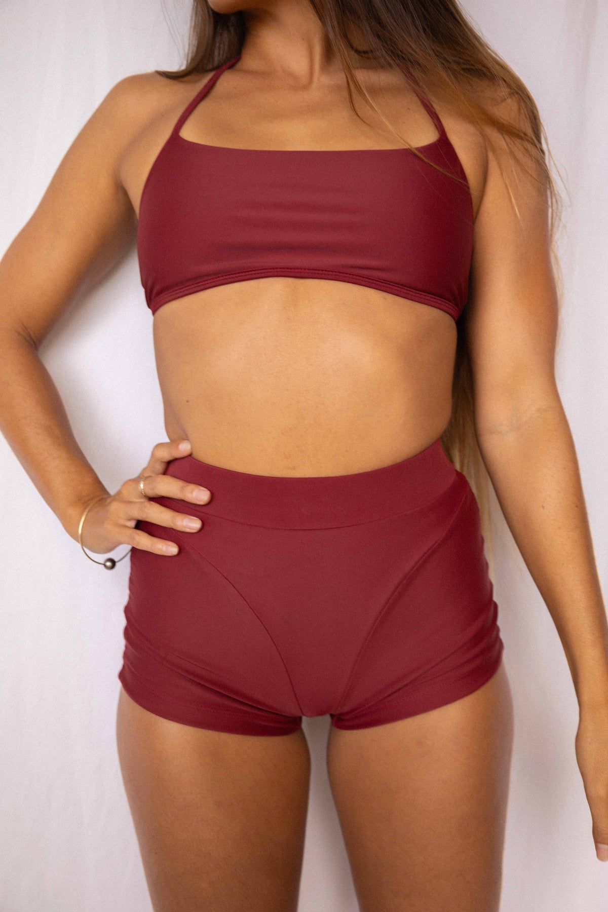 Niki Surf Top and Shorts set in Deep Merlot, front torso view showing square neckline, thin straps, and high-waist short silhouette