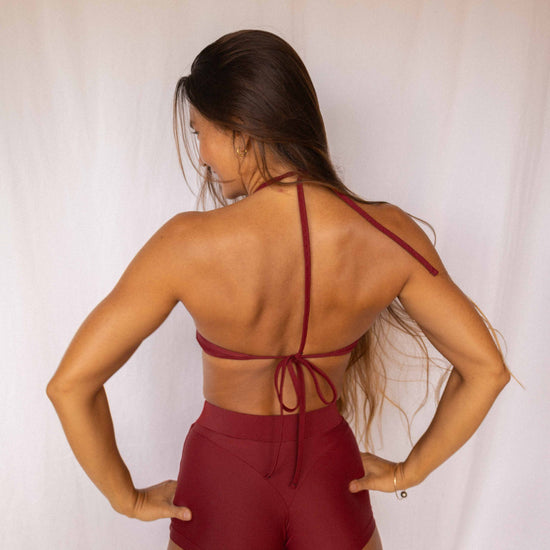 Niki Surf Shorts and Top set in Deep Merlot, full back view showing open back halter straps and high-waist short construction
