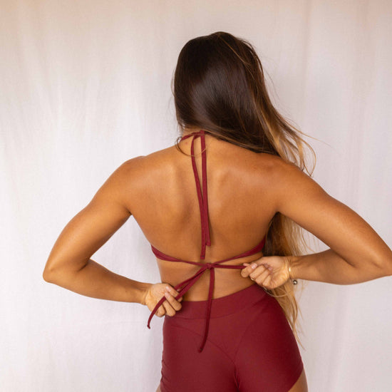 Niki Surf Top and Shorts set in Deep Merlot, full back view showing crossback tie straps and high-waist short construction
