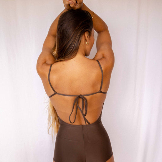 Emi Surf Suit in Coffee — back view showing open back with adjustable tie detail and high-waist coverage