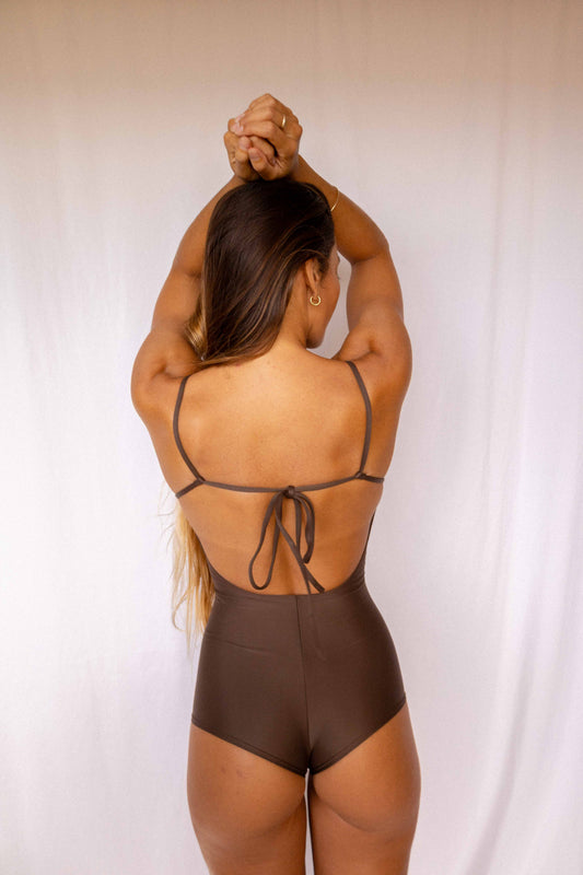 Emi Surf Suit in Coffee — back view showing open back with adjustable tie detail and high-waist coverage