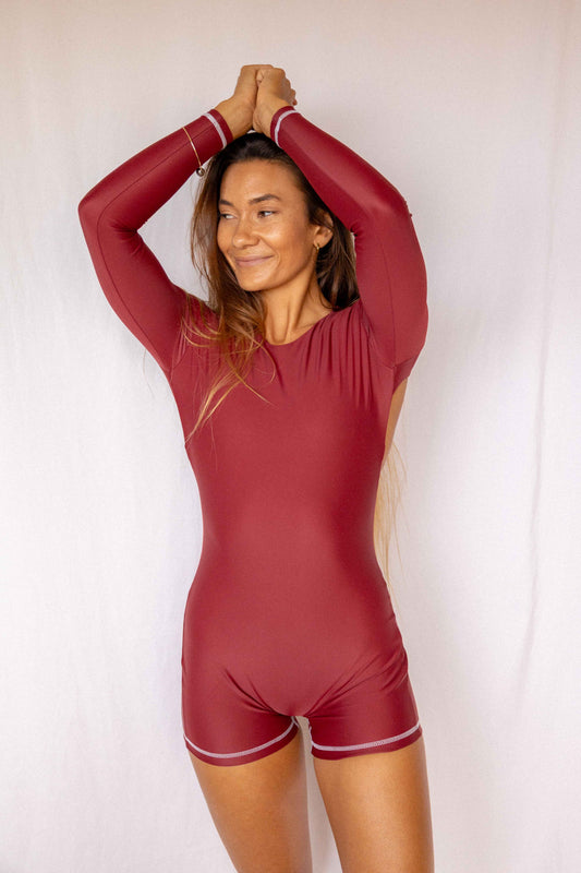 Anou Long-Sleeve Surf Suit in Deep Merlot, front close-up showing round neckline, long-sleeve construction and contrast stitch detail by Antidote The Label