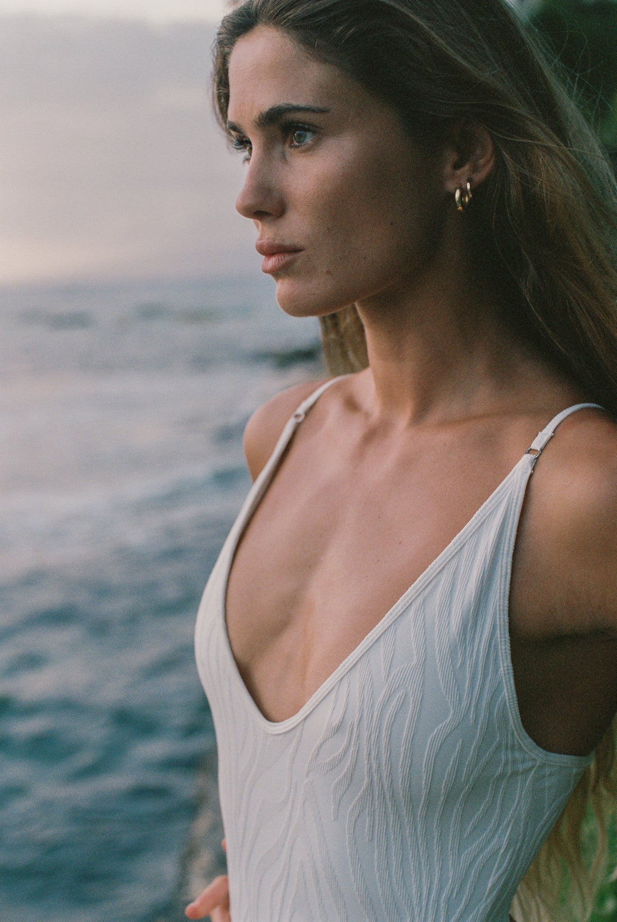 Zoe One Piece in Ivory worn at sunset on the beach, women's one piece swimsuit by Antidote The Label