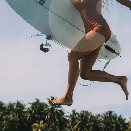 Elle Surf Suit Deep Merlot, side view surf lifestyle 