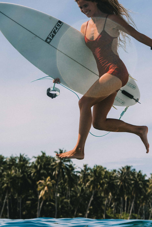 Elle Surf Suit Deep Merlot, side view surf lifestyle 